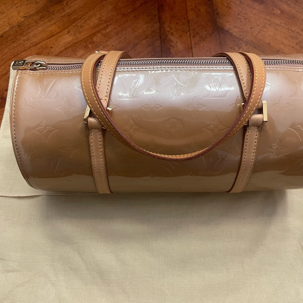 Louis Vuitton Glossy Beige Barrel Bag
Vintage